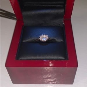 circle ring with pink/yellow stone in the middle